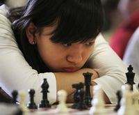 Chess girl thinking hard