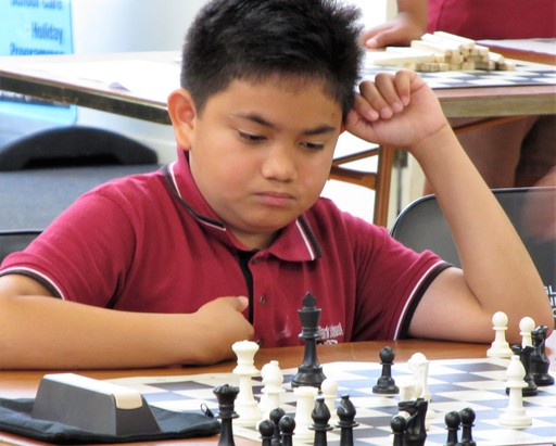 Student participating in Chess Power cluster event