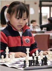 Young girl playing Chess