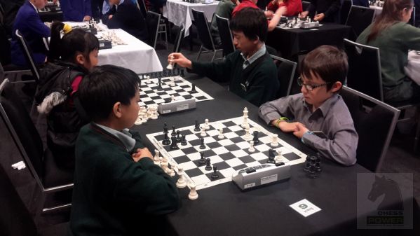 Charlie Samson [right] (James Hargest College) tries to contain Boss Wongs' (Somerville Intermediate, Auckland) activity