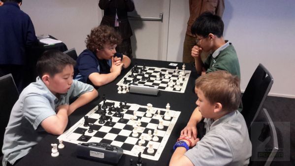 Board 1 far board: [left] Rico Fraser (Nelson College Preparatory School) vs Daniel Gong [right] (Mt Roskill Intermediate)